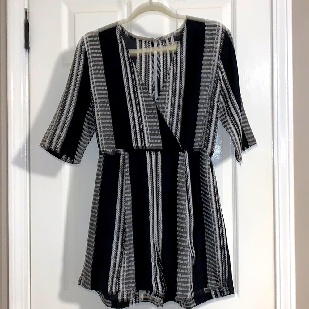 WYATT black & white pattern short sleeve short romper.        Size Medium